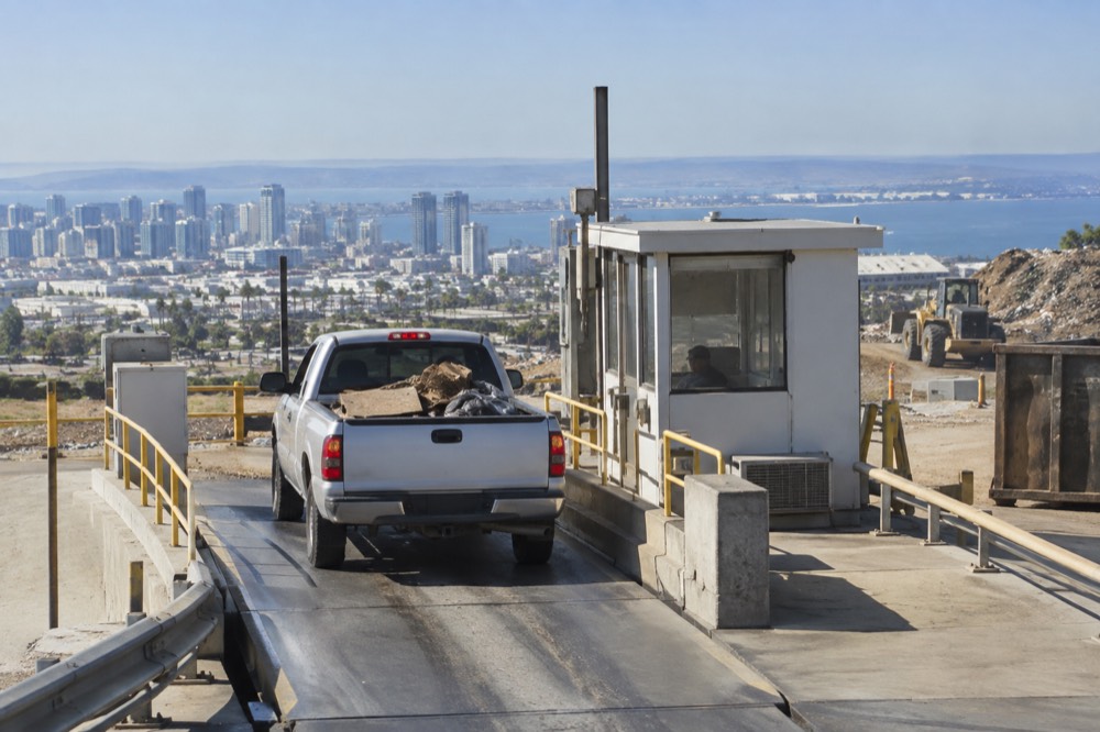 A pickup truck at a landfill scale house waiting to be weighed