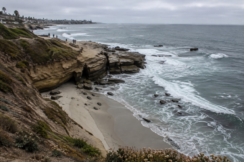 Waves breaking along the La Jolla coastline on an overcast morning