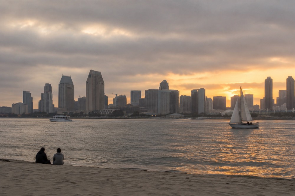 View across San Diego Bay from Coronado toward the downtown skyline at golden hour