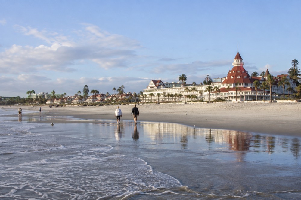 Wooden lobby interior of the Hotel del Coronado with white columns and natural light