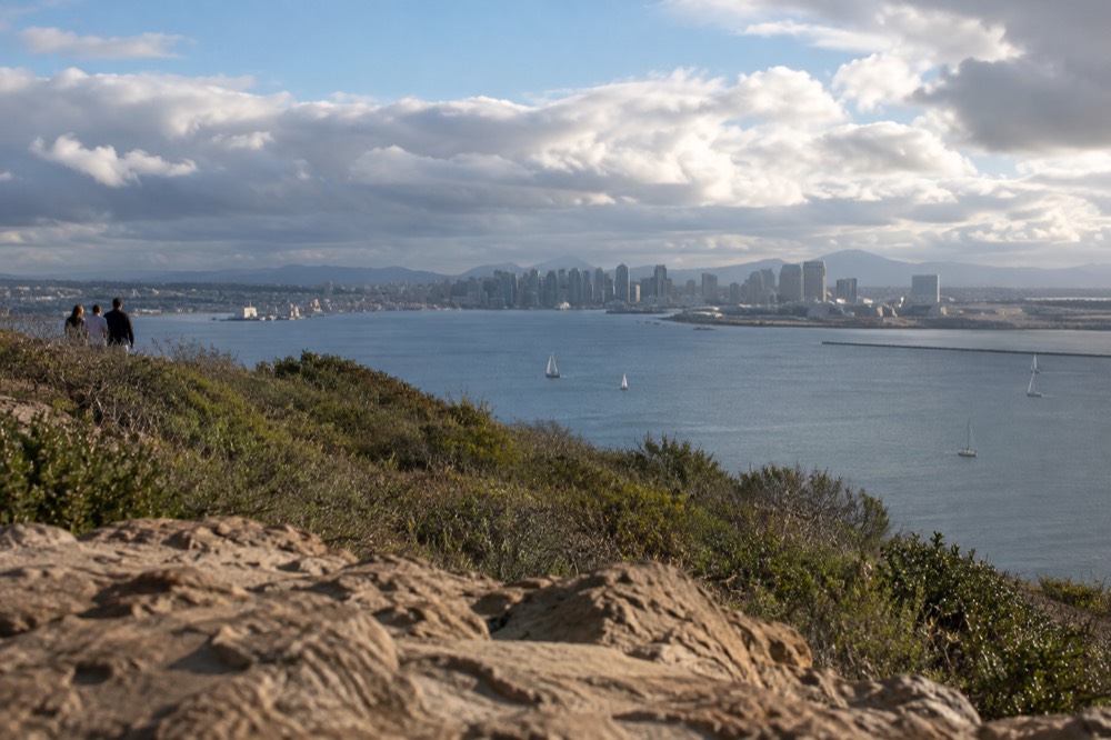View over San Diego Bay from the Point Loma peninsula with downtown skyline in the distance