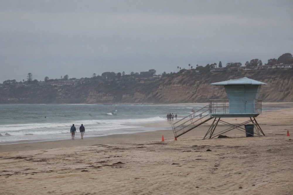 Long sandy beach at La Jolla Shores with the lifeguard tower and gentle surf