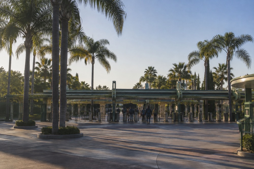 Theme park entrance turnstiles in early morning light