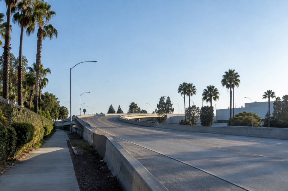 Empty freeway onramp in blue early morning light