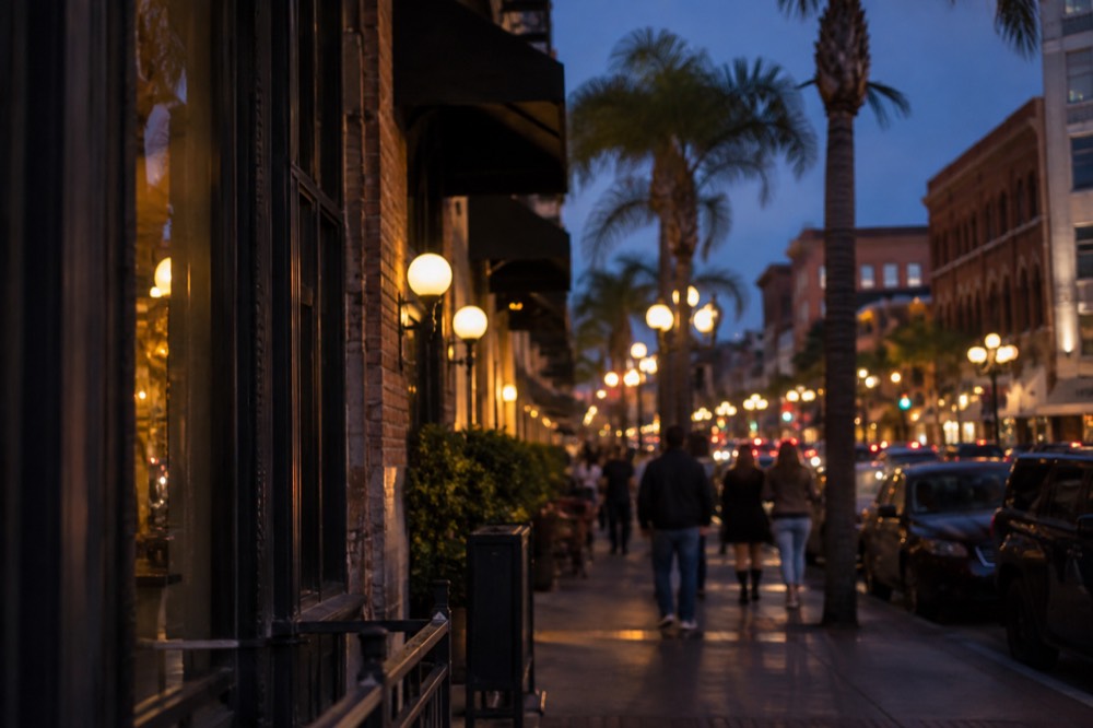 Evening lights and illuminated signage along a Gaslamp Quarter street