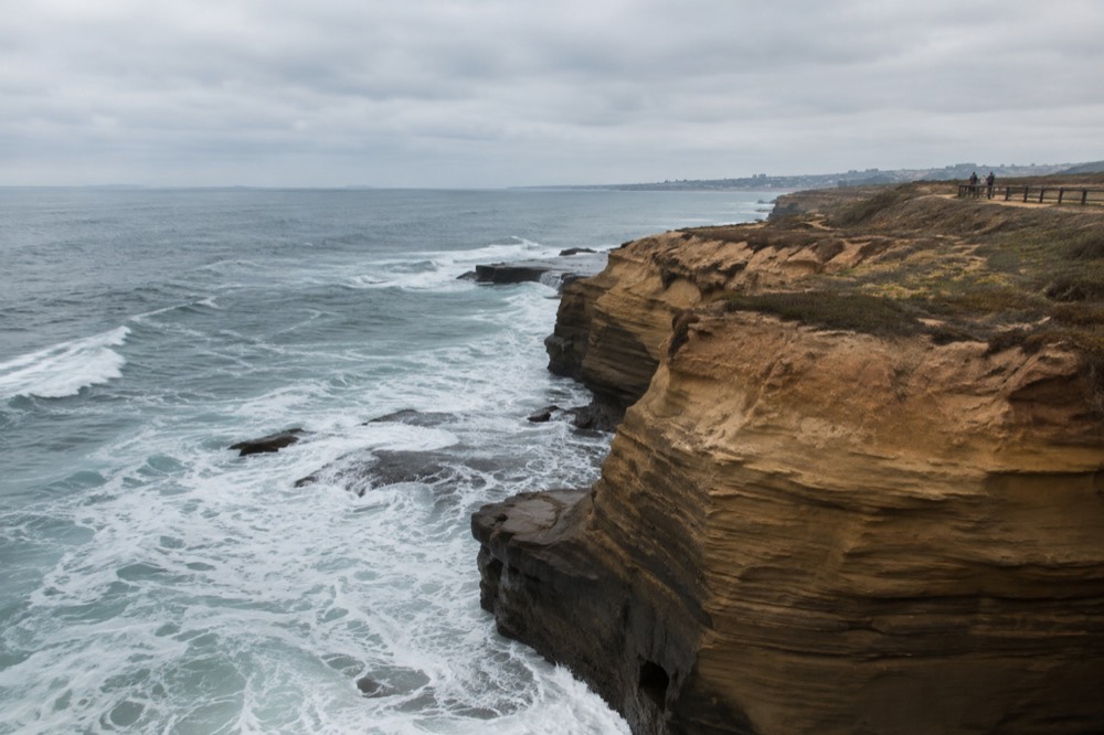 Sandstone cliffs above the ocean at Sunset Cliffs with waves breaking below