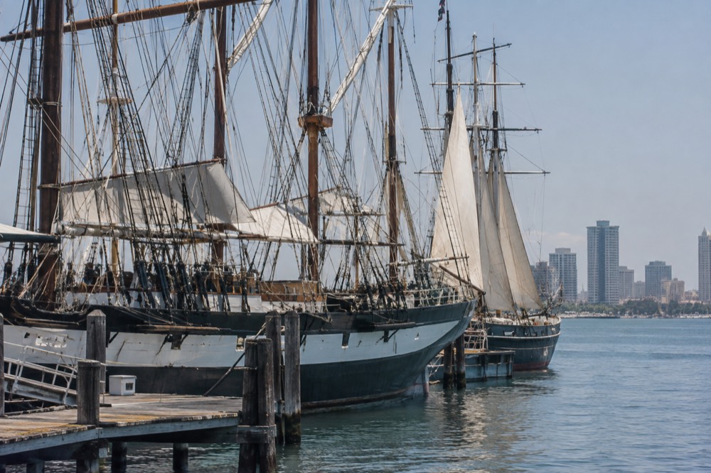 Historic sailing ships moored at the Maritime Museum along the San Diego Embarcadero