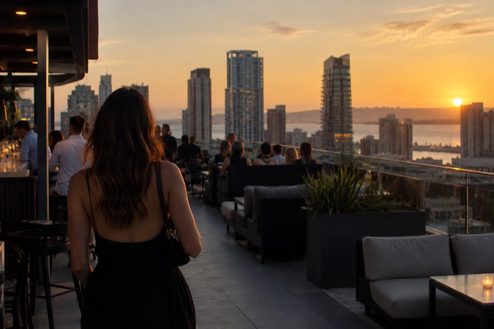 Rooftop bar overlooking downtown San Diego skyline at dusk