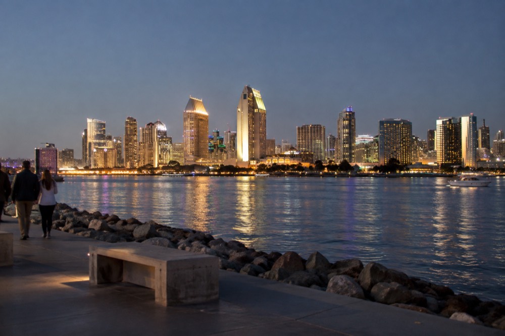 Illuminated downtown San Diego skyline seen across the bay at night
