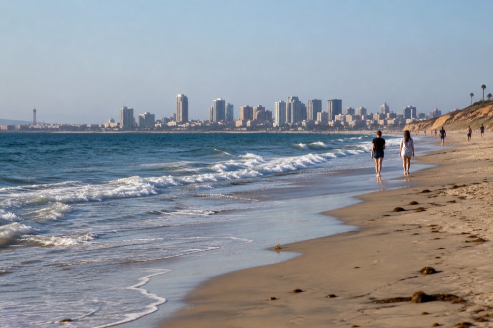Sunny September afternoon on a quiet San Diego beach with gentle waves