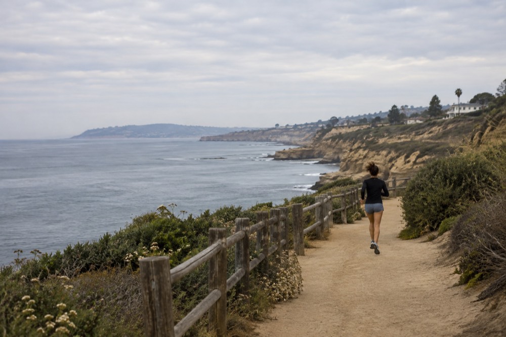 Overcast morning sky above La Jolla coastline with calm Pacific water