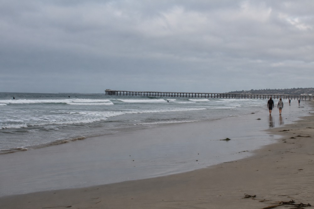 Gray marine layer clouds breaking apart over Pacific Beach in late morning