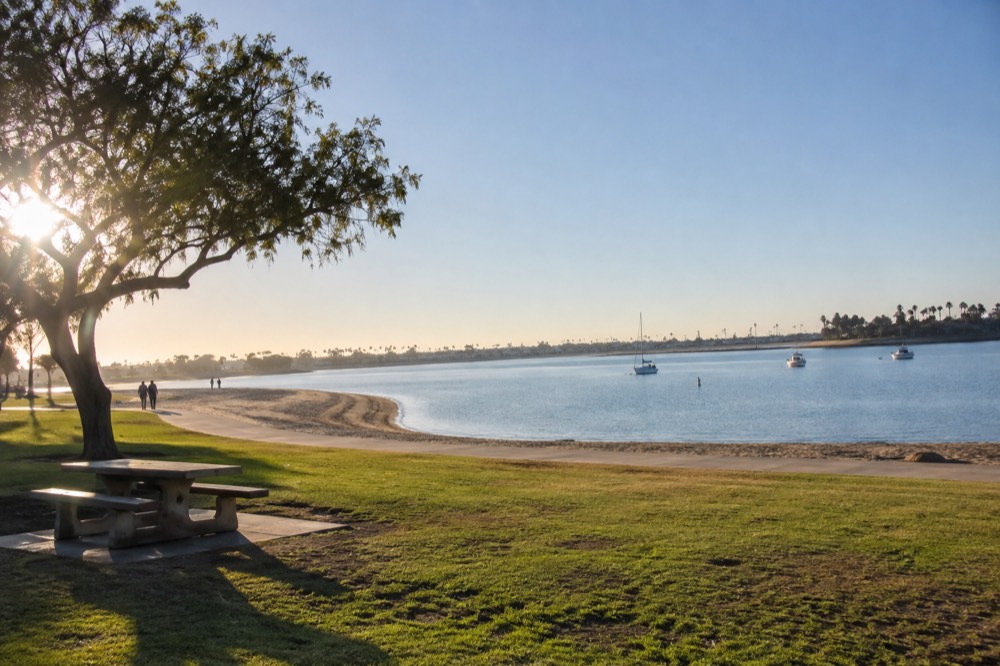 Clear October morning over Mission Bay with calm water and blue sky