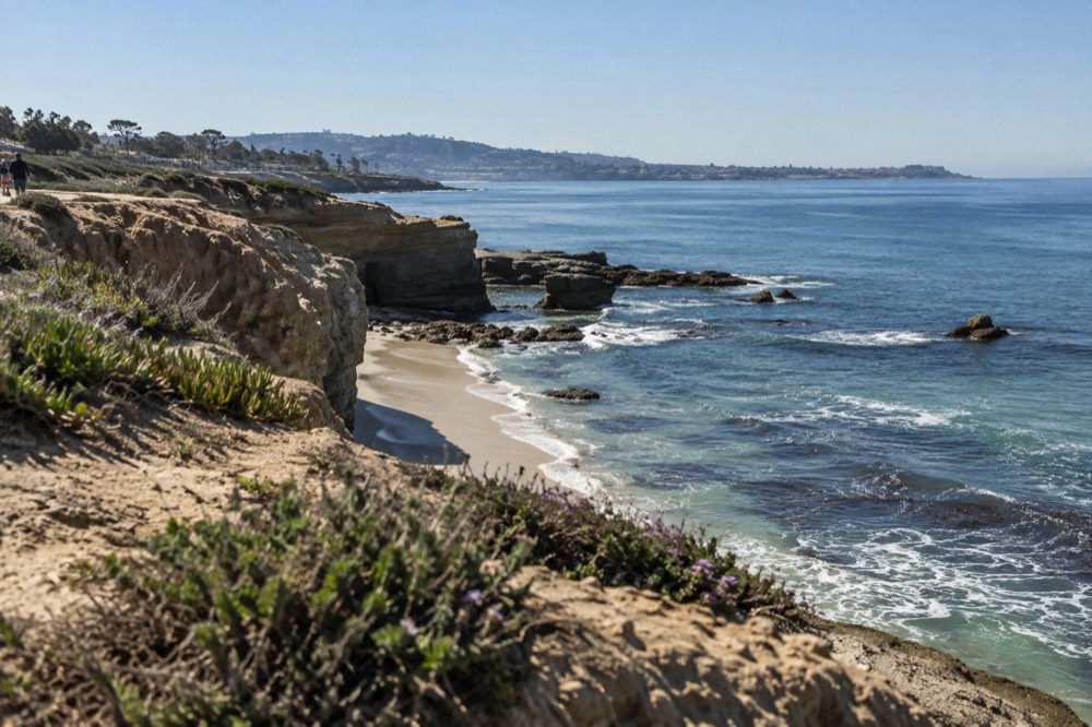 La Jolla coastline with cliffs and clear water on a calm morning