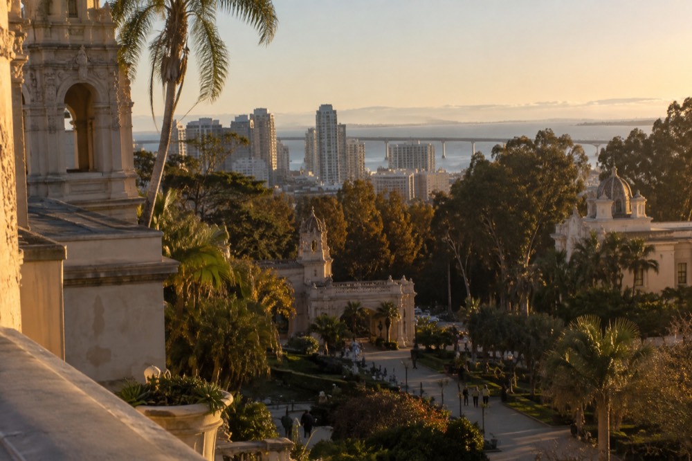 Gardens and Spanish colonial style buildings along the El Prado walkway