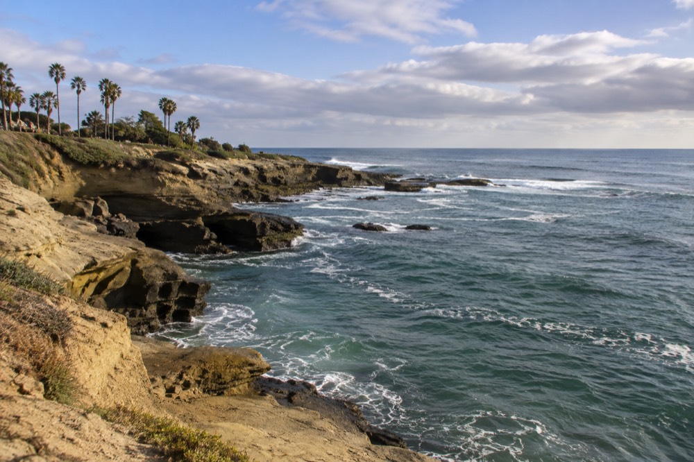 Turquoise water and rocky cliffs along the La Jolla Cove coastline